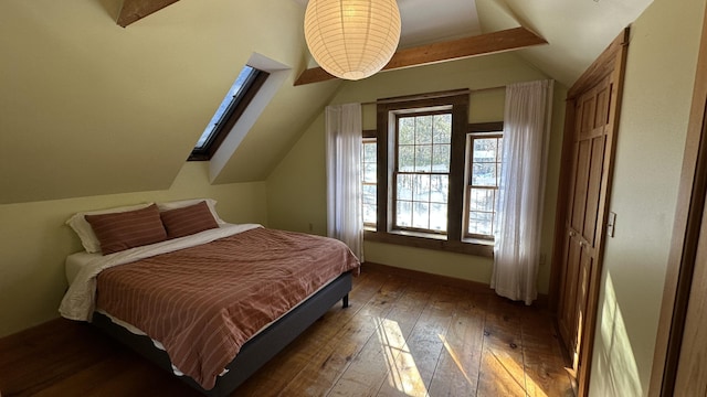 bedroom featuring dark wood-type flooring and lofted ceiling