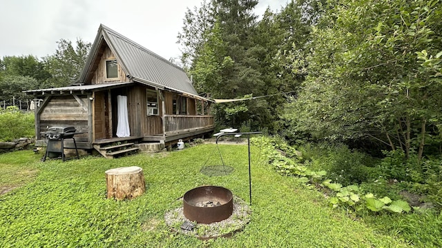 view of side of home with cooling unit and a yard