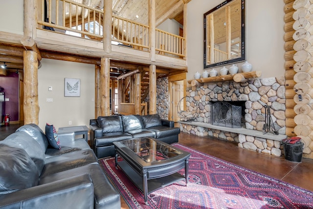 living room featuring a high ceiling, a stone fireplace, rustic walls, and wood ceiling