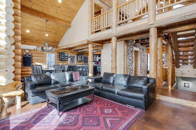 living room with high vaulted ceiling, wooden ceiling, a notable chandelier, log walls, and decorative columns