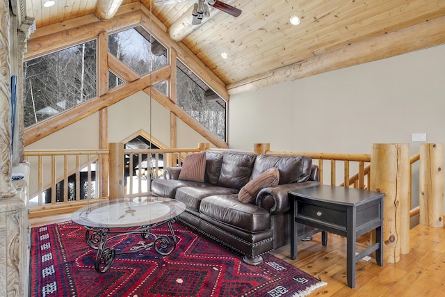 living room featuring beamed ceiling, ceiling fan, hardwood / wood-style floors, and wood ceiling