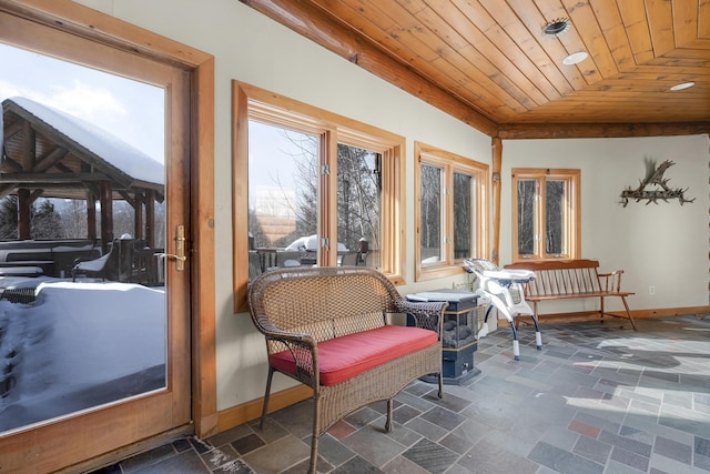 sunroom featuring wood ceiling and vaulted ceiling