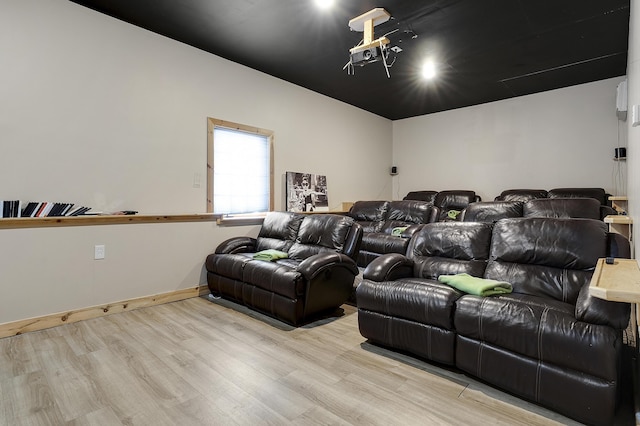 cinema room featuring light hardwood / wood-style flooring