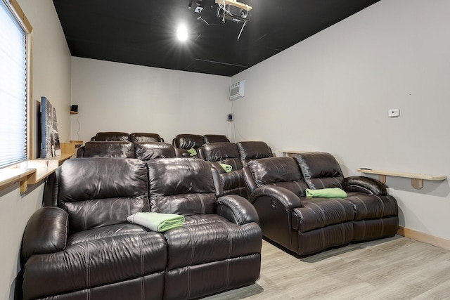 cinema with light wood-type flooring