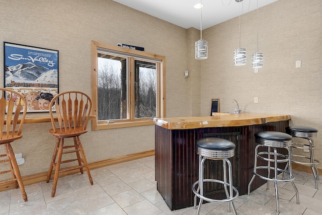 bar featuring decorative light fixtures