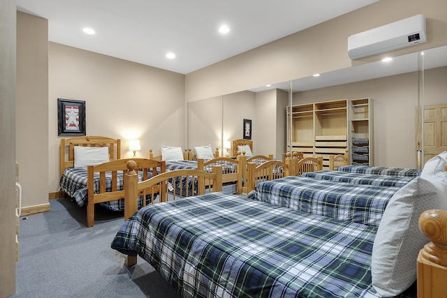 carpeted bedroom with a wall mounted air conditioner