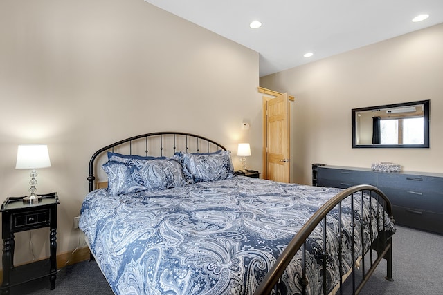 bedroom featuring dark colored carpet