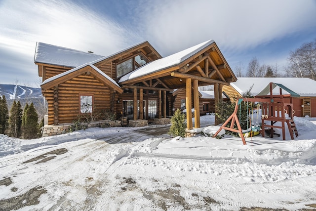 view of front of home with a playground