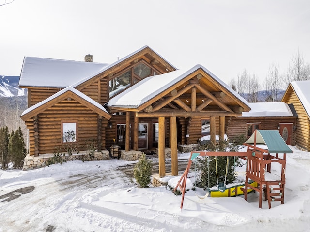 view of front of house with a playground