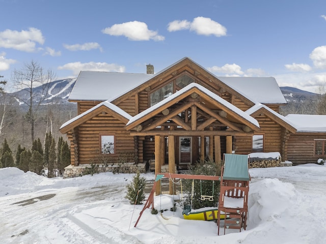 log home featuring a mountain view