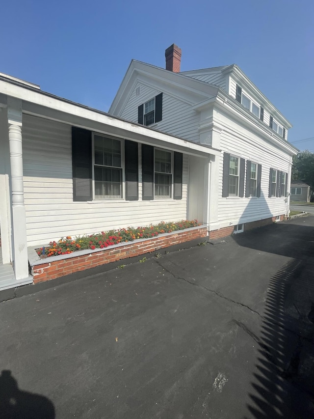 exterior space featuring a chimney