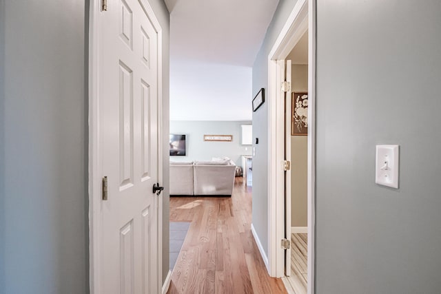 corridor featuring light wood-type flooring