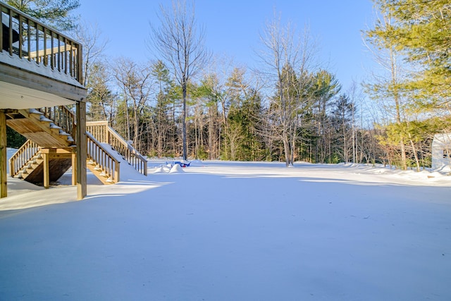 view of yard layered in snow