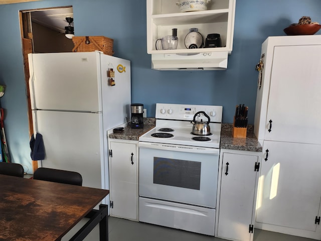 kitchen featuring white appliances and white cabinets