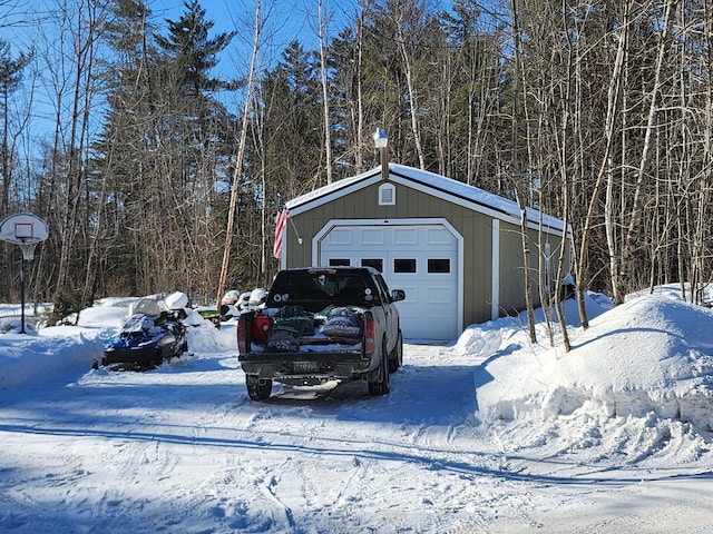 view of snow covered garage