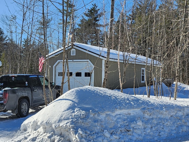 view of snow covered garage