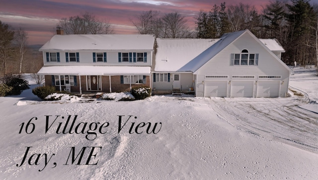 view of front of home featuring a garage and covered porch