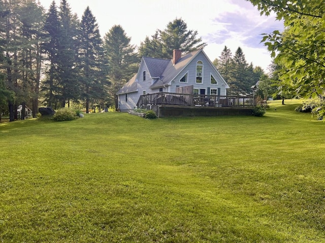 view of yard featuring a wooden deck