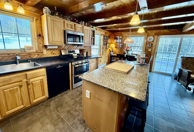 kitchen with sink, wood ceiling, decorative light fixtures, appliances with stainless steel finishes, and wooden walls