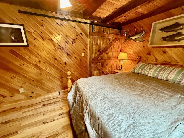 bedroom with beamed ceiling, wood ceiling, and wood walls