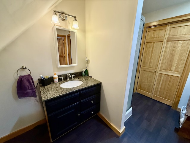 bathroom with vanity and hardwood / wood-style floors