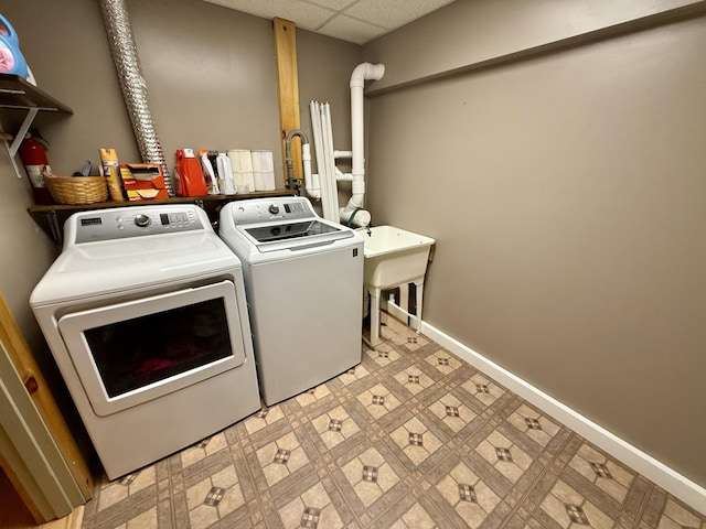 washroom featuring washing machine and dryer