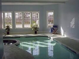 view of swimming pool featuring a hot tub