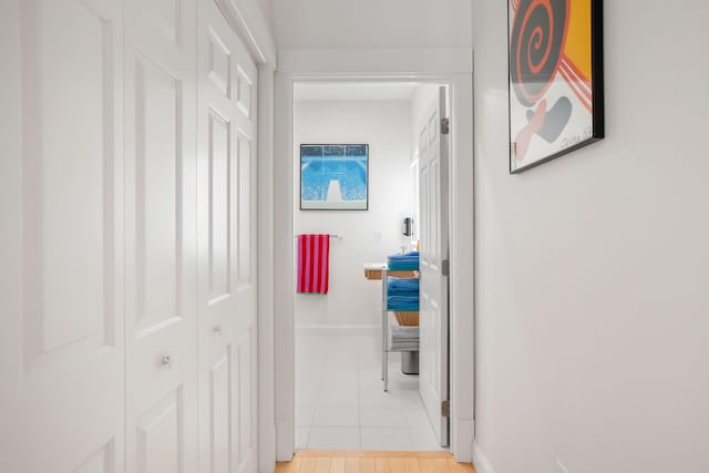 hallway with light tile patterned flooring