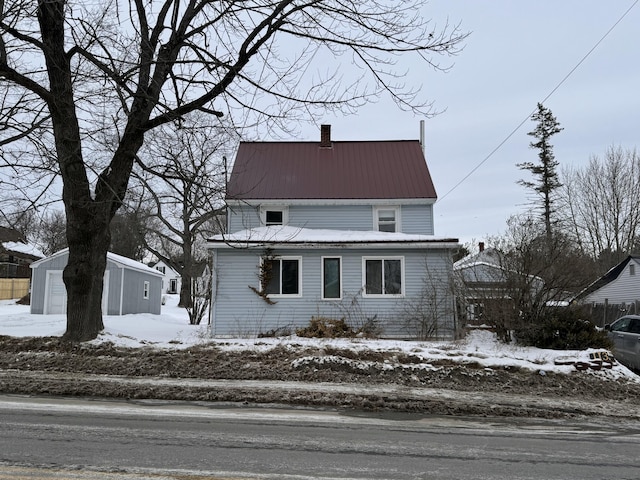 view of property with an outbuilding and a garage