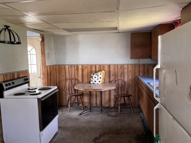113 Eastern Ave, Augusta, ME 04330 - dining room featuring a drop ceiling, wood walls, and wainscoting