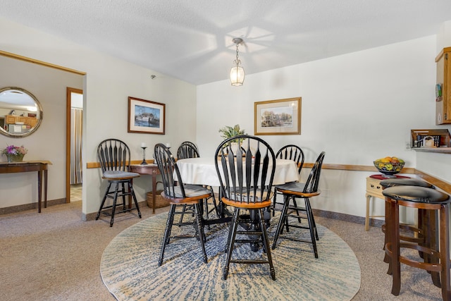 dining room with a textured ceiling