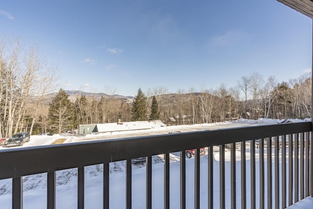 snowy yard with a balcony