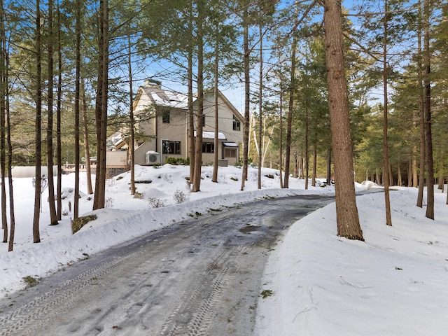 exterior space featuring a garage and a chimney