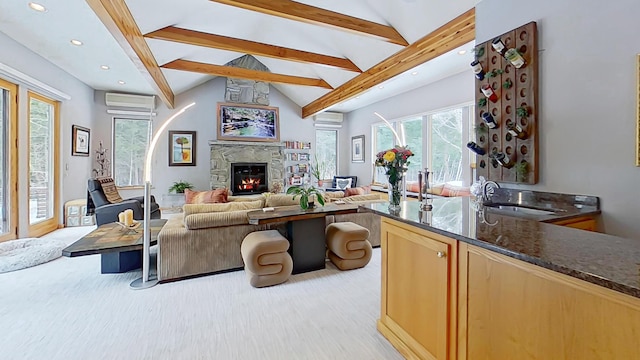 living room with recessed lighting, a stone fireplace, a wall mounted air conditioner, and lofted ceiling with beams