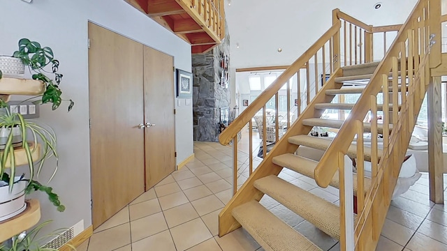 stairs with tile patterned floors