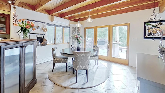 dining room featuring light tile patterned floors, beamed ceiling, a wall mounted AC, and plenty of natural light