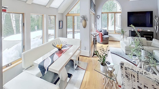 sunroom with vaulted ceiling with beams