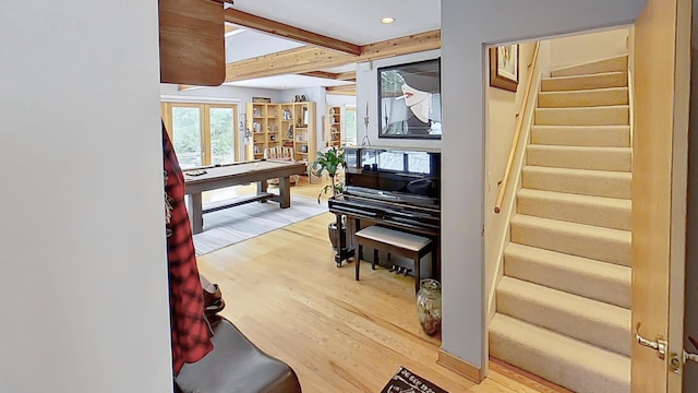 interior space with french doors, recessed lighting, stairway, wood finished floors, and beamed ceiling