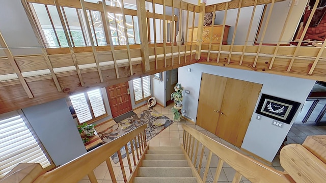 stairway featuring tile patterned floors