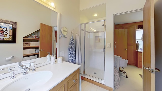 bathroom featuring a stall shower and vanity