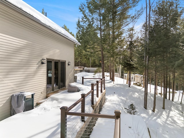 view of snow covered deck