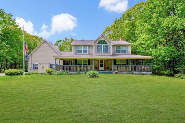 32 Beaver Pond Rd, Kennebunkport, ME 04046 - view of front of home with a chimney, a front lawn, and covered porch