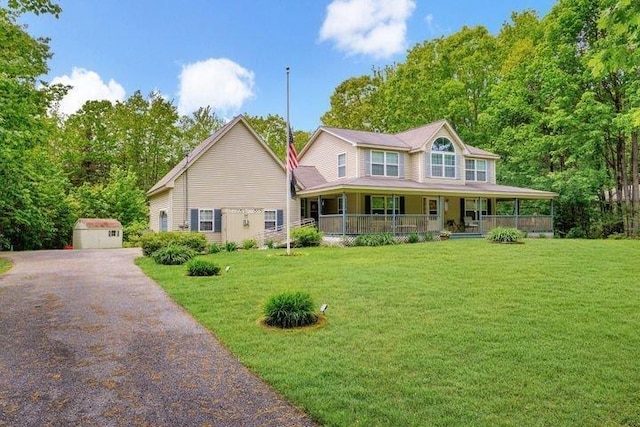 32 Beaver Pond Rd, Kennebunkport, ME 04046 - view of front facade with a front yard, an outdoor structure, and covered porch