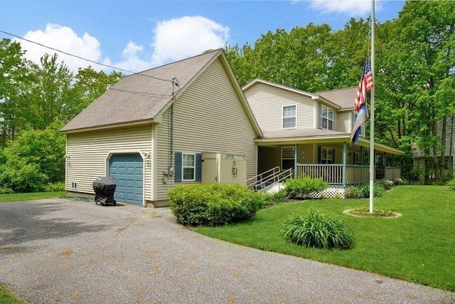 32 Beaver Pond Rd, Kennebunkport, ME 04046 - view of front of property with a porch, aphalt driveway, a garage, and a front lawn
