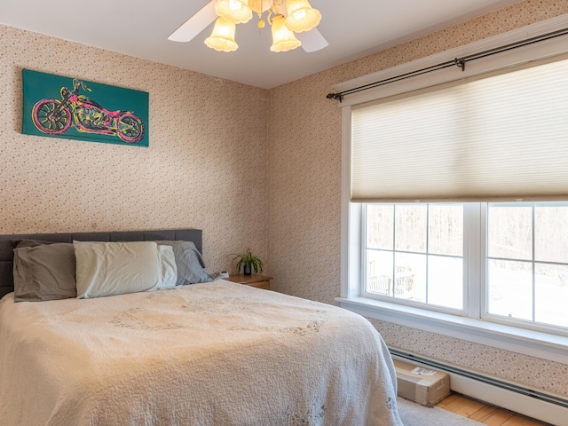 27 Orchard Ln, Minot, ME 04258 - bedroom featuring a baseboard radiator, wallpapered walls, and ceiling fan