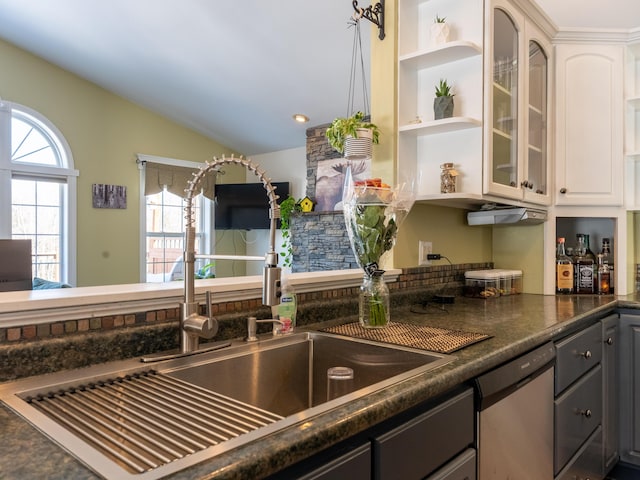 27 Orchard Ln, Minot, ME 04258 - kitchen with stainless steel dishwasher, vaulted ceiling, dark countertops, glass insert cabinets, and open shelves