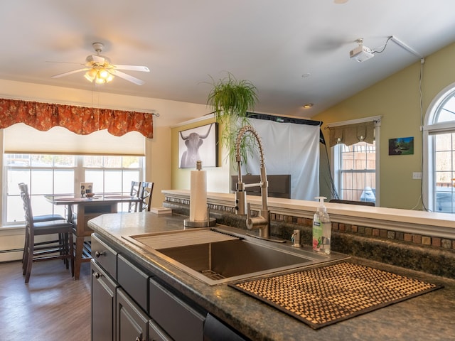 27 Orchard Ln, Minot, ME 04258 - kitchen featuring dark countertops, a ceiling fan, wood finished floors, and vaulted ceiling