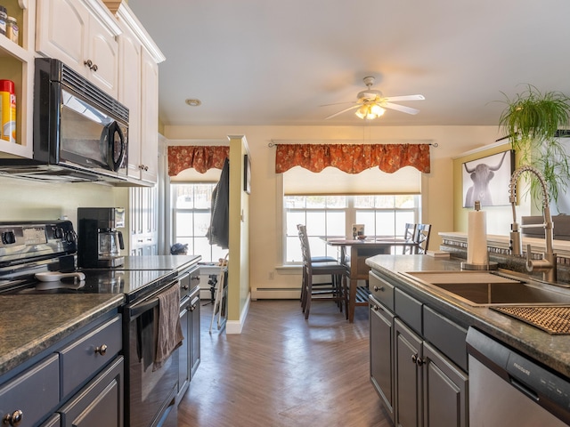27 Orchard Ln, Minot, ME 04258 - kitchen featuring black appliances, white cabinets, dark countertops, and dark wood-style flooring