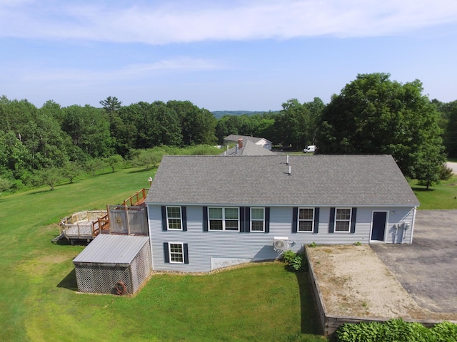27 Orchard Ln, Minot, ME 04258 - view of front facade featuring a front lawn, a deck, and roof with shingles
