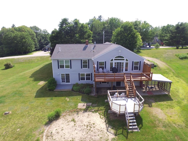 27 Orchard Ln, Minot, ME 04258 - rear view of property with a deck, stairway, a lawn, a chimney, and view of wooded area